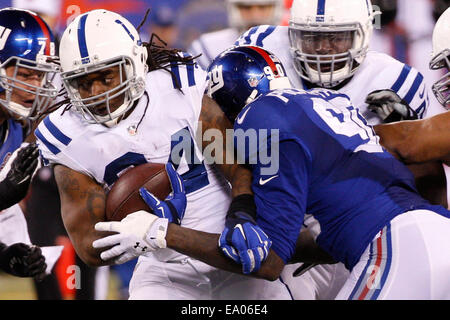 November 3, 2014: Indianapolis Colts running back Trent Richardson (34) runs with the ball as New York Giants defensive end Jason Pierre-Paul (90) tries to tackle him during the NFL game between the Indianapolis Colts and the New York Giants at MetLife Stadium in East Rutherford, New Jersey. The Indianapolis Colts won 40-24. (Christopher Szagola/Cal Sport Media) Stock Photo