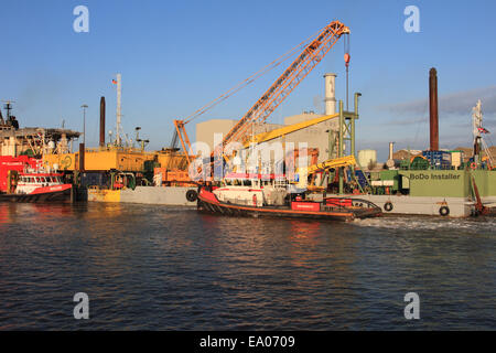 Great Yarmouth harbour, loading goods, crain lefting, power station at back ground, Norfolk, UK Stock Photo