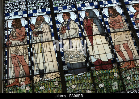 Stained glass window 'The Seven Spiritual Works of Mercy' designed by Austrian artist Koloman Moser (1907) in the Steinhof Church (Kirche am Steinhof) in Vienna, Austria. Saints and Old Testaments characters are depicted in the stained glass window from left to right: Saint John the Baptist, Saint Francis de Sales, Saint Clemens Maria Hofbauer, Saint Teresa of Avila and Joseph of Egypt. Stock Photo