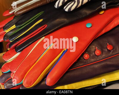 Display of brightly coloured colored overlapping high quality leather gloves Stock Photo