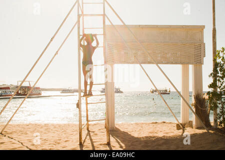 Boy playing by seaside, Sharm El Sheikh, Egypt Stock Photo