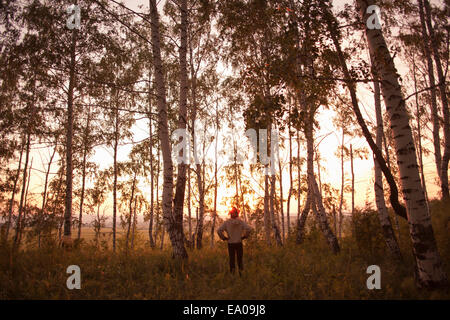 Man in forest, Sarsy village, Sverdlovsk region, Russia Stock Photo