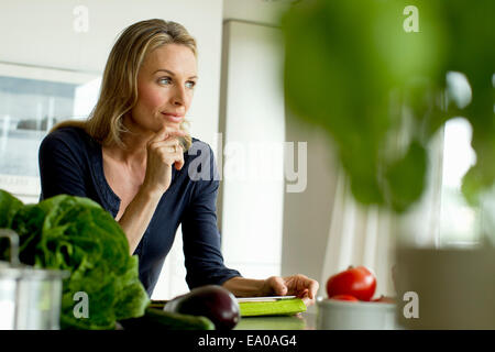 Mature woman with digital tablet Stock Photo
