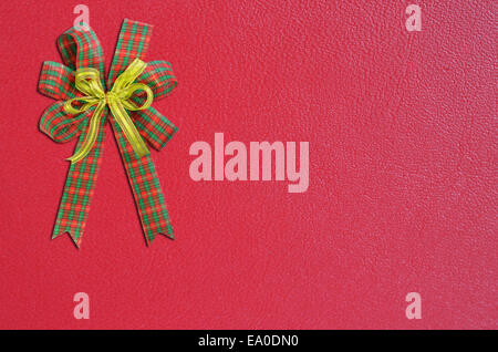 Gift bow on red background Stock Photo