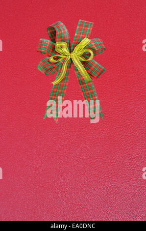 Gift bow on red background Stock Photo