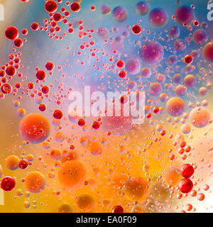 oil drops on water surface with colorful gradient background Stock Photo