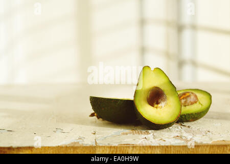 Fresh avocado on wooden rusty background Stock Photo