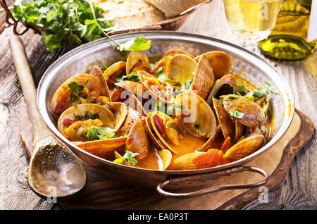 venus clams in tomato sauce Stock Photo