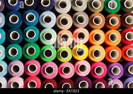 Sewing threads as a multicolored background close up Stock Photo