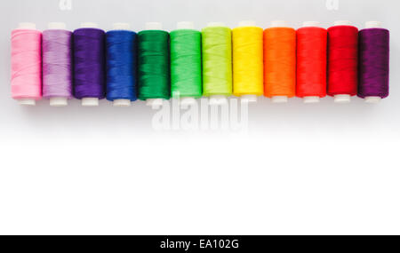 Sewing multicolored  threads isolated on a white Stock Photo
