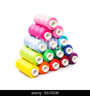 Sewing multicolored  threads as a pyramid isolated on white Stock Photo