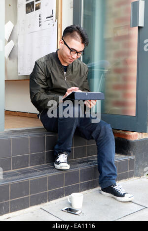 Male architect using digital tablet on office step Stock Photo