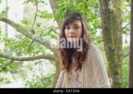 Portrait of young woman in woods Stock Photo