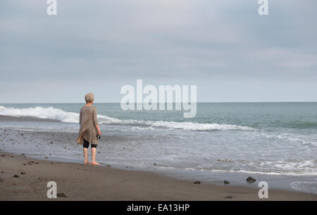 Rear view of senior woman gazing out to sea, Dana Point, California, USA Stock Photo