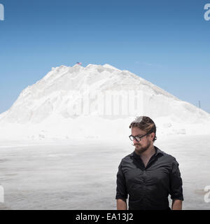 Portrait of man in front of white mountain Stock Photo