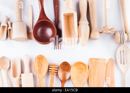 Assortment of wooden kitchen utensils on a white background Stock Photo