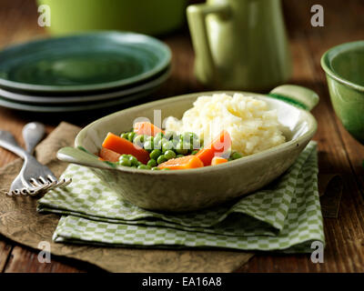 Maris Piper mashed potatoes, peas and carrots Stock Photo