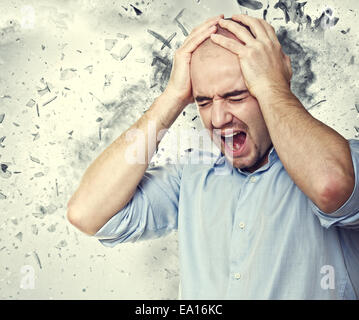 stressed man and background explosion Stock Photo