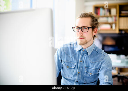 Graphic designer working at computer Stock Photo