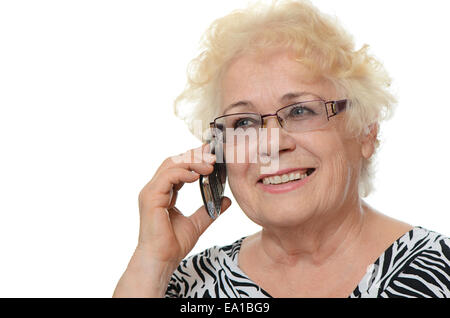 The elderly woman speaks on phone Stock Photo