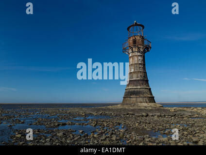 Whiteford Lighthouse is the only wave swept cast iron lighthouse in Britain. See here at low tide. Whiteford Point, Whiteford Sa Stock Photo