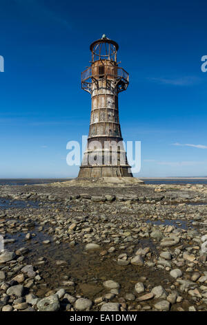 Whiteford Lighthouse is the only wave swept cast iron lighthouse in Britain. See here at low tide. Whiteford Point, Whiteford Sa Stock Photo