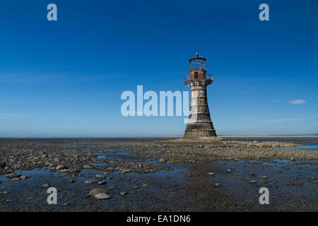 Whiteford Lighthouse is the only wave swept cast iron lighthouse in Britain. See here at low tide. Whiteford Point, Whiteford Sa Stock Photo