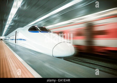 modern high speed train passing station Stock Photo