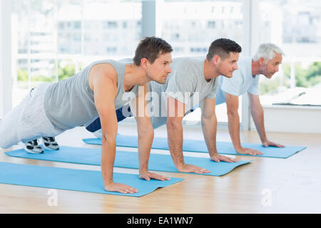 Men doing push ups Stock Photo