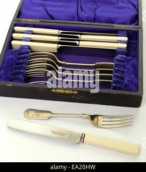Boxed set of old antique vintage Henry Tatton of Edinburgh cutlery silverware knives and forks isolated on white background  Model Release: No.  Property release: No. Stock Photo