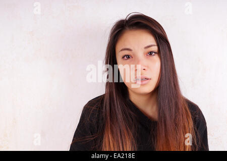 crying young asian woman with tears running down her cheeks Stock Photo