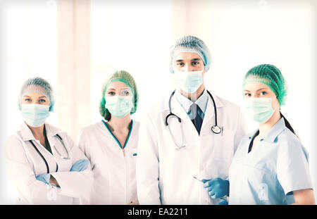 group of doctors in operating room Stock Photo