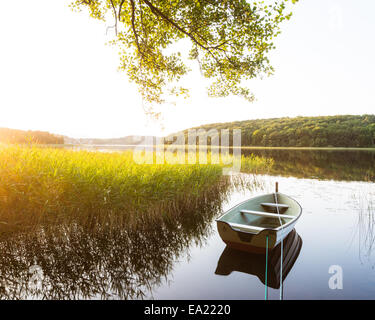 Moored boat reflection on lake Stock Photo