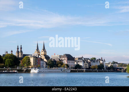 View across Moselle River to cruise boat wharf and skyline of old town of Koblenz, Rhineland-Palatinate, Germany, Europe Stock Photo