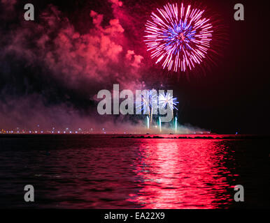 Fireworks with reflection on the sea Alghero Sardinia Italy Stock Photo
