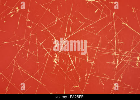 Plastic red background with bright scratches Stock Photo