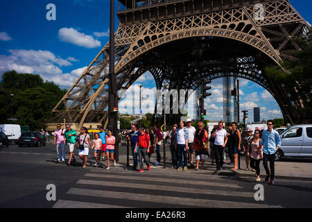 Tourists crossing the road in front of Eiffel tower, Paris, France. Stock Photo