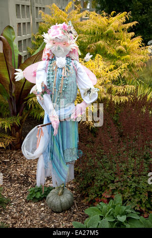 Full size Halloween figure dressed as a whimsical butterfly catcher.  Minnesota Arboretum, Chaska Minnesota MN USA Stock Photo