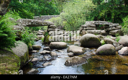 Ancient Clapper Bridge across the River Dart at Dartmeet, Dartmoor, Devon, England, Stock Photo