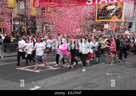 17th Annual EIF Revlon Run Walk for Women, hosted by Revlon Global Brand Ambassadors Emma Stone and Andy Cohen, kicks off in Times Square  Featuring: Atmosphere,Crowd Where: NYC, New York, United States When: 03 May 2014 Stock Photo