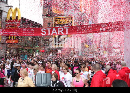 17th Annual EIF Revlon Run Walk for Women, hosted by Revlon Global Brand Ambassadors Emma Stone and Andy Cohen, kicks off in Times Square  Featuring: Atmosphere,Crowd Where: NYC, New York, United States When: 03 May 2014 Stock Photo