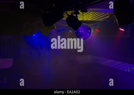 Empty Night Club Lit by Colored Spotlights Stock Photo