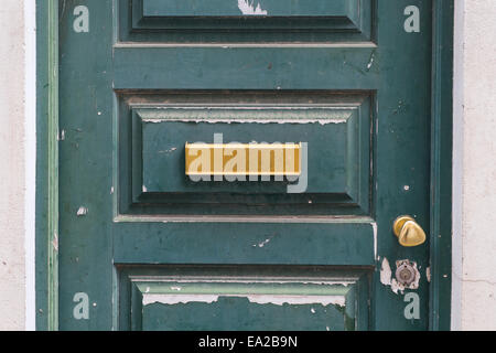 Letters slot at Old Wooden Door in Lisbon, Portugal. Stock Photo