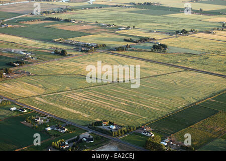 An aerial view of farmland with center pivot sprinklers and other agricultural irrigation methods. Stock Photo