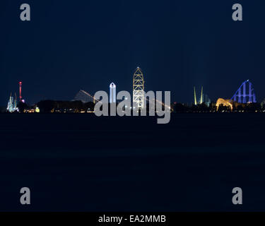 night time shot of Cedar Point in Sandusky with amusement park rides lit up Stock Photo