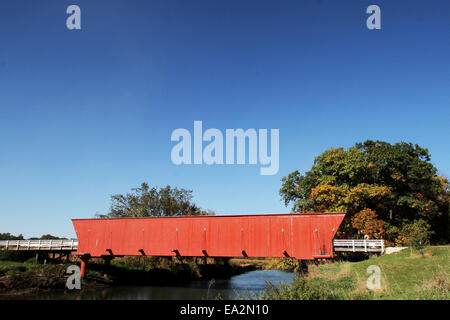 Winterset, IOWA, USA. 11th Oct, 2014. The Hogback Bridge is the northernmost of the six remaining covered bridges in Madison County located four miles Northwest of Winterset, Iowa. It is the original 1884 structure at its original location. The bridge piers have been replaced with steel supports, and the structure was extensively renovated in 1992. The bridge was in use until 1993, when it was bypassed by a new concrete bridge located 200 feet south of the structure. The Hogback Bridge, as well as the Holliwell, Roseman and original Cedar bridges, were all built in the early 1880s by Madison Stock Photo