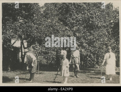 Photograph depicting children playing croquet Stock Photo