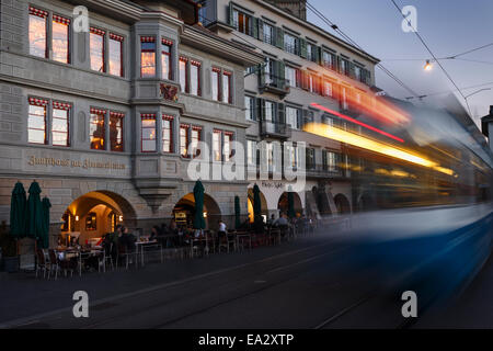 House of the Guild of Carpenters with motion blurred tram, Zurich, Switzerland. Stock Photo