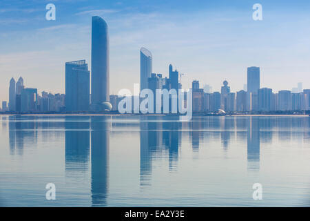 View of City skyline reflecting in Persian Gulf, Abu Dhabi, United Arab Emirates, Middle East Stock Photo