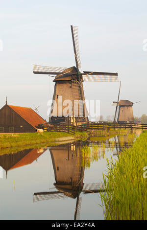 Windmills along a Canal, Schermerhorn, North Holland, Netherlands, Europe Stock Photo